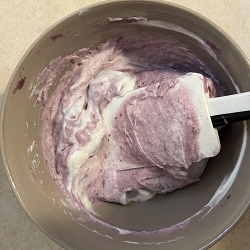 Ube halaya being stirred in a pot