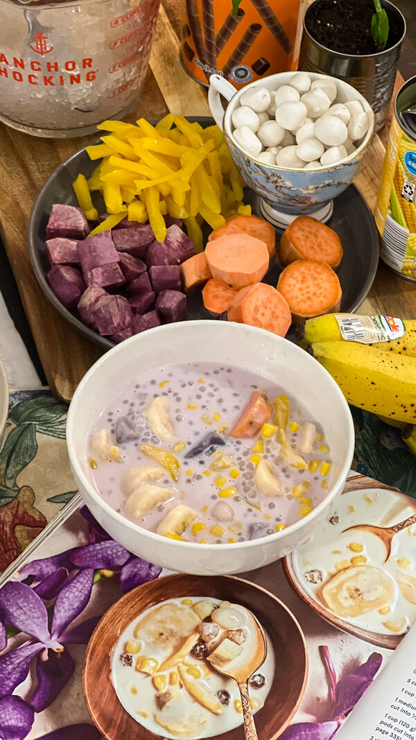 A table of ube cubes, sweet potato, banana and a bowl of ginataang